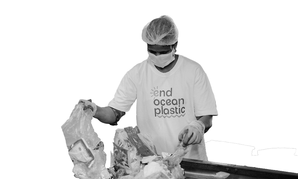 Worker sorting recycled ocean plastic